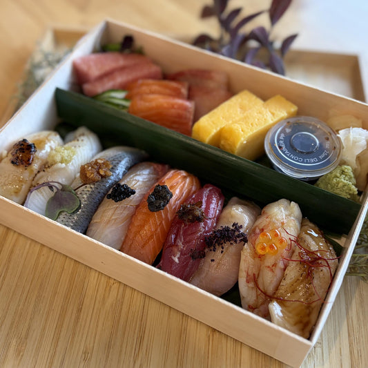 Chef's Selection with Sashimi: assorted nigiri, sashimi and tamago in a wooden box