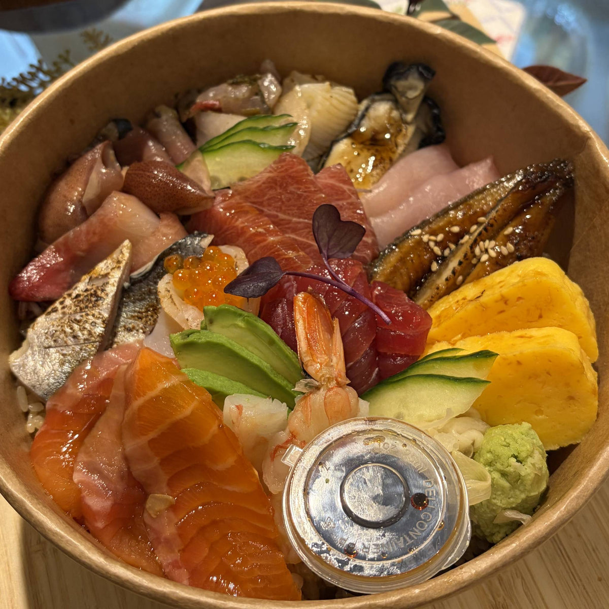 Premium Sashimi Don: assorted sashimi over rice in a takeaway bowl
