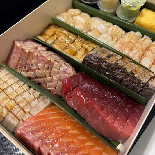 Sashimi Platter, 80 pieces, with rows of sliced fish in a wooden box